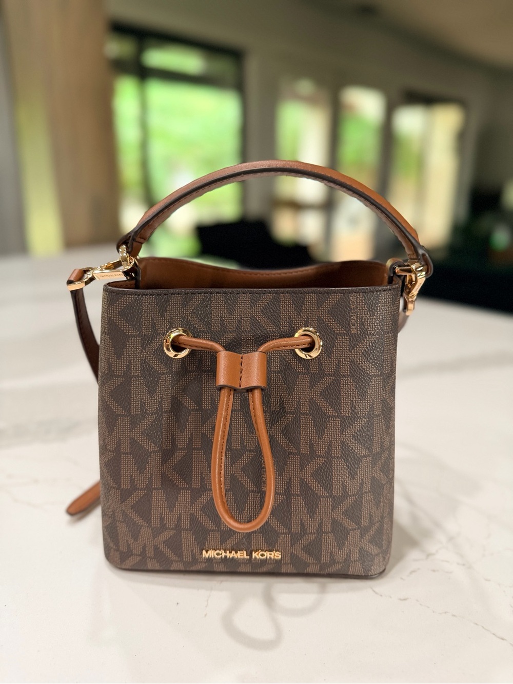 Michael Kors Brown MK Logo Drawstring Mini Bucket Bag with Tan Trim